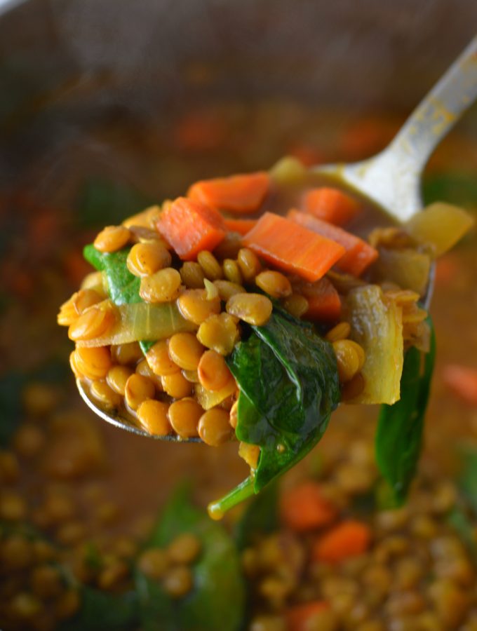 Easy Vegan Coconut Curry Lentil Soup recipe. Made with coconut milk and spinach, this makes a comforting meatless dinner idea.