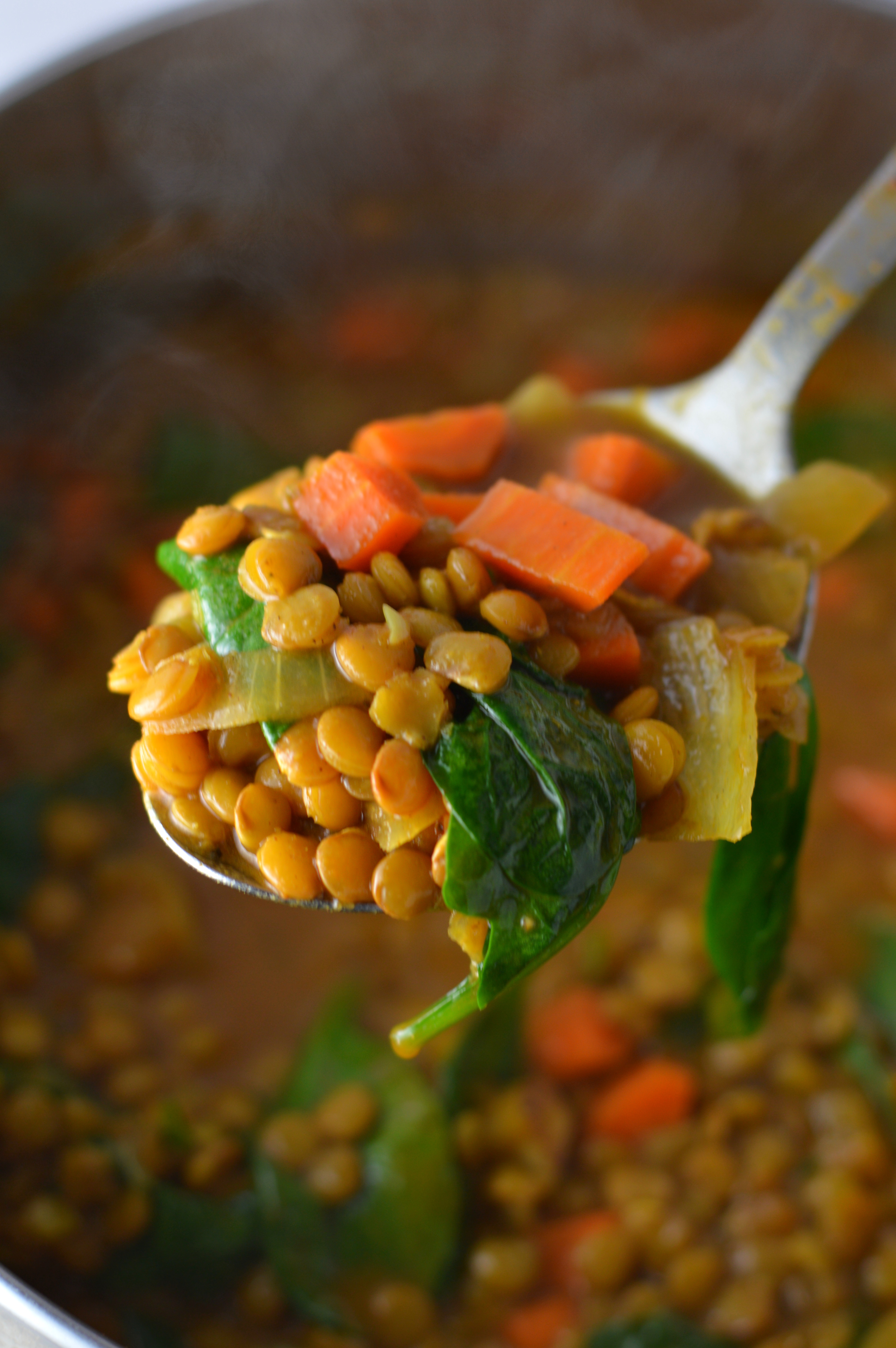 Easy Vegan Coconut Curry Lentil Soup recipe. Made with coconut milk and spinach, this makes a comforting meatless dinner idea.