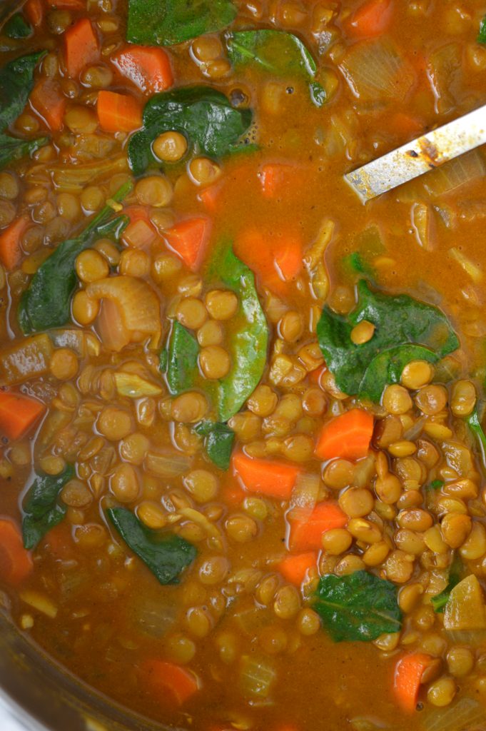 Easy Vegan Coconut Curry Lentil Soup recipe. Made with coconut milk and spinach, this makes a comforting meatless dinner idea.