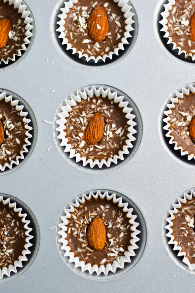 Overhead view of Almond Joy Nutella Cups in a mini muffin pan.