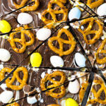 Sliced Chocllate Easter Bark with pretzels and mini eggs.