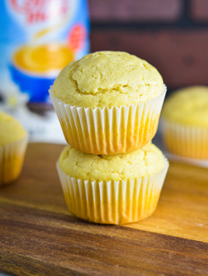 Two Vanilla Creamer Muffins stacked on top of each other.