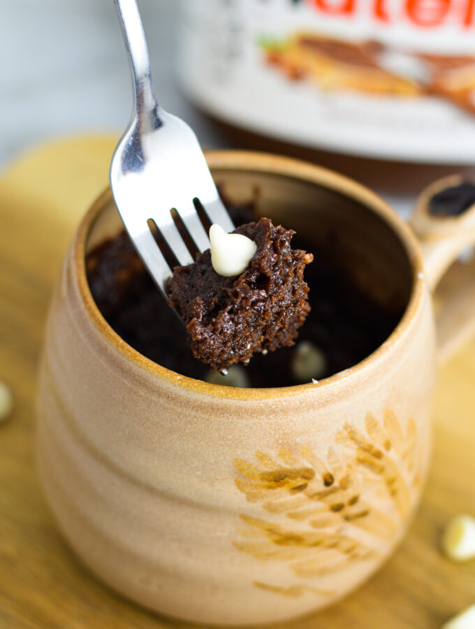 A fork with a bite of White Chocolate Nutella Mug Cake.