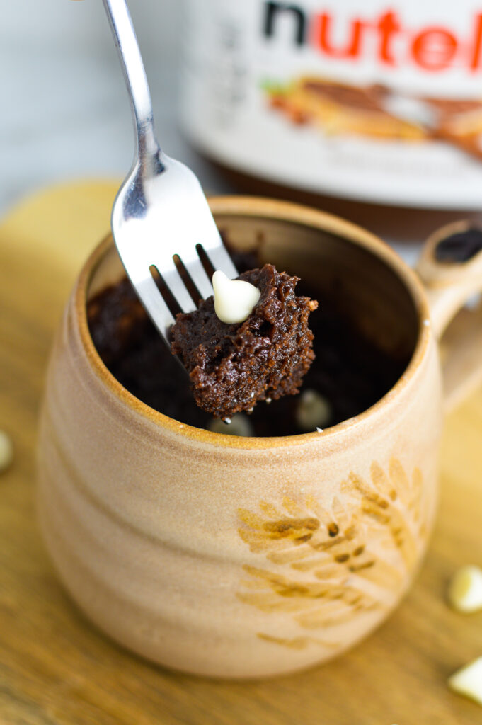 A fork with a bite of White Chocolate Nutella Mug Cake.