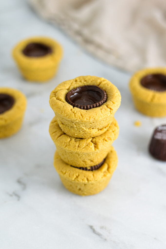 3 Dark Chocolate Peanut Butter Cookie Cups stacked.