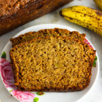 Ginger Banana Bread with the loaf and brown bananas beside it.