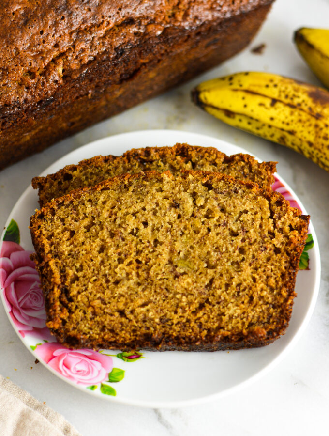 Ginger Banana Bread with the loaf and brown bananas beside it.