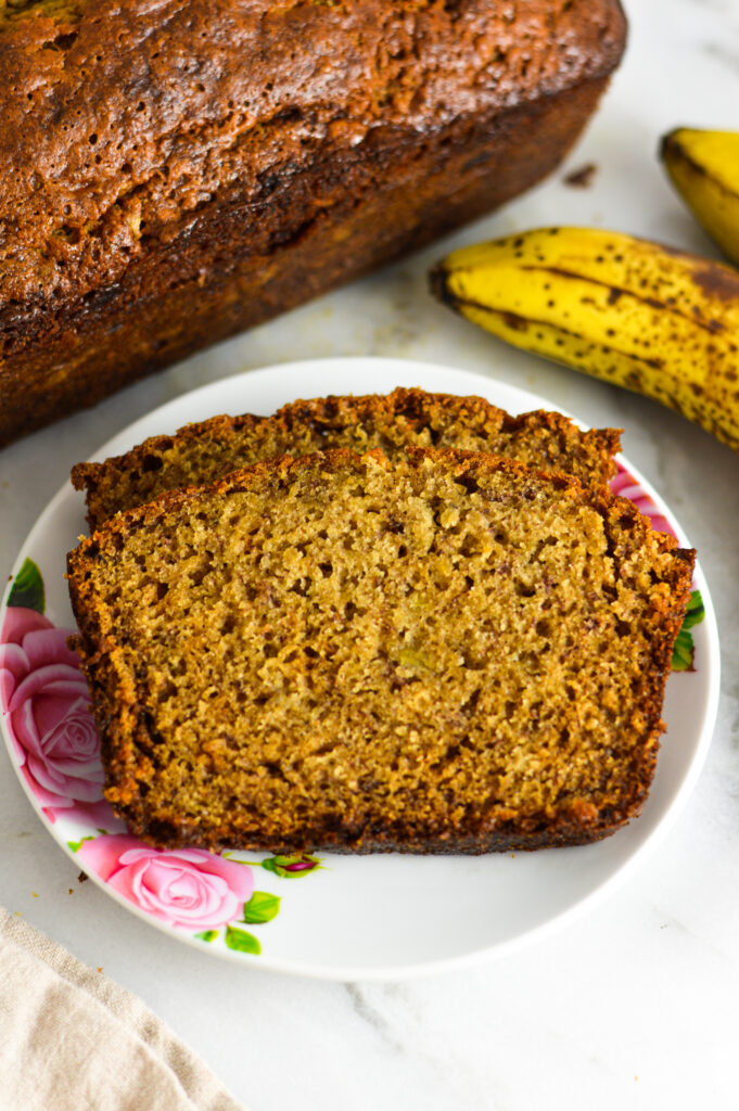 Ginger Banana Bread with the loaf and brown bananas beside it.