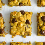 Overhead view of Oatmeal Butterscotch Chocolate Chip Cookie Bars sliced into squares.