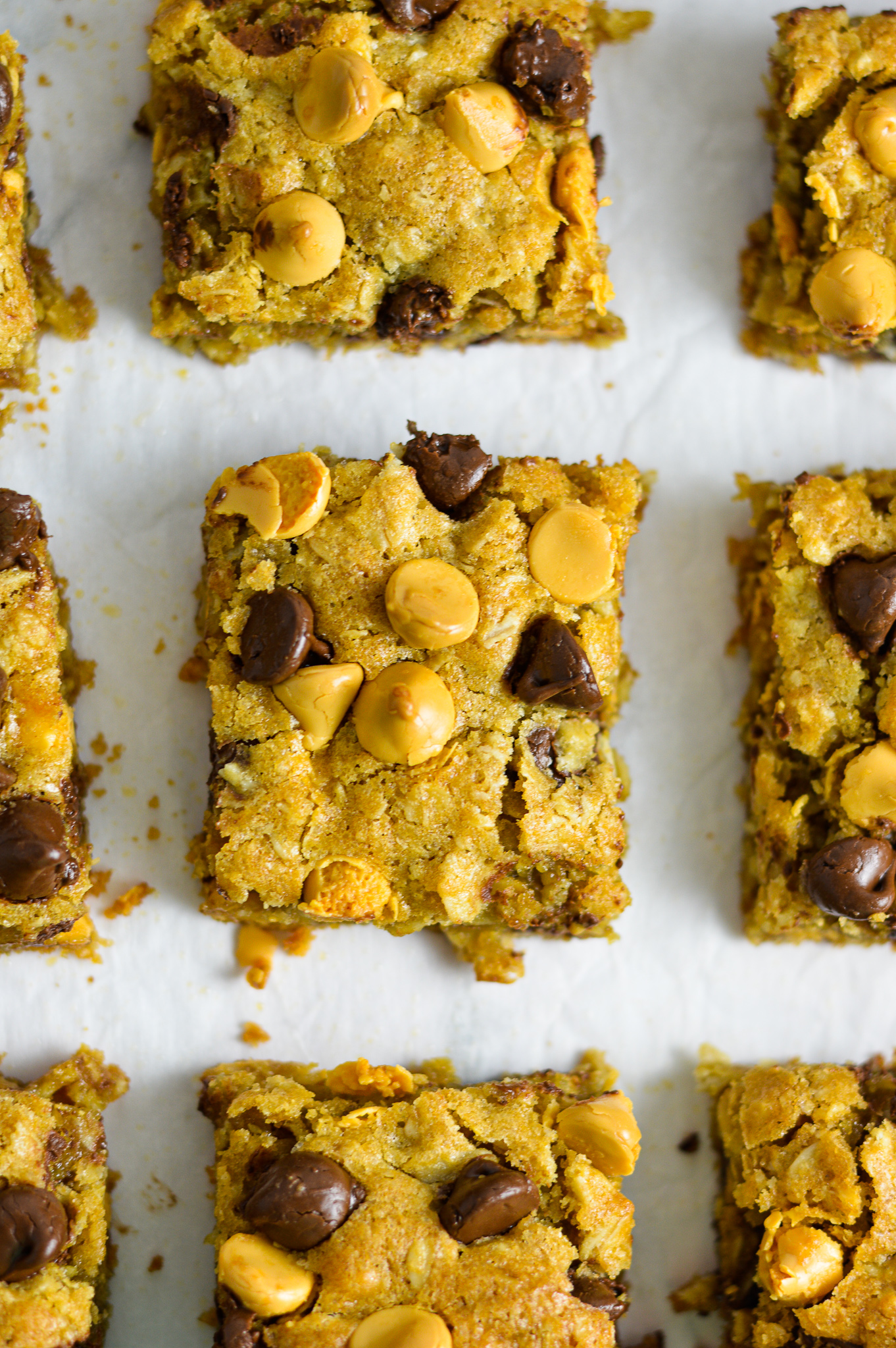 Overhead view of Oatmeal Butterscotch Chocolate Chip Cookie Bars sliced into squares.