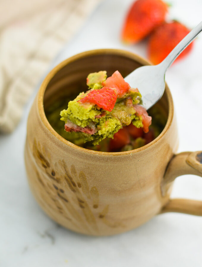 A fork with some Strawberry Matcha Mug Cake on it.