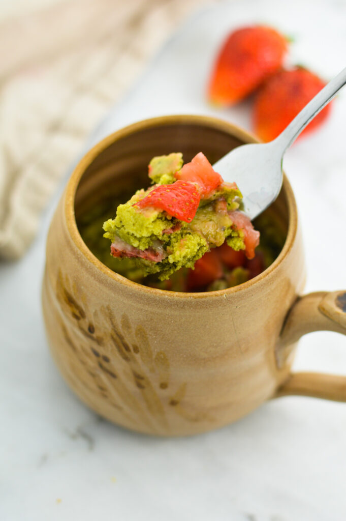 A fork with some Strawberry Matcha Mug Cake on it. 