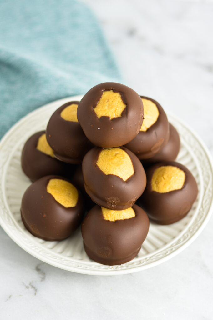 Buckeyes fudge candy balls on a small plate.