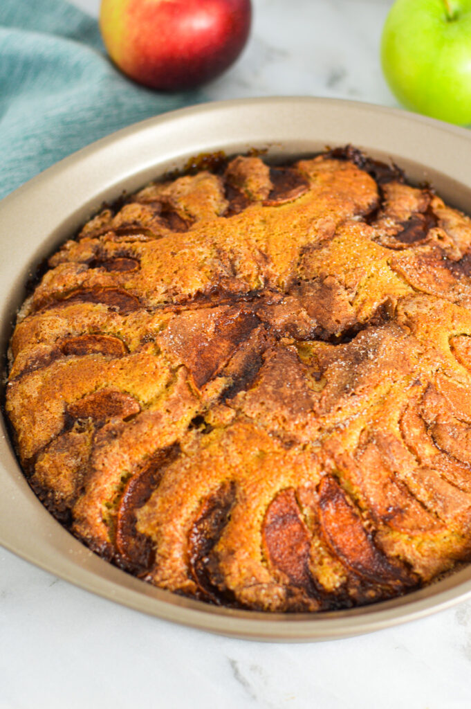 Dutch Apple Cake in a round cake pan.