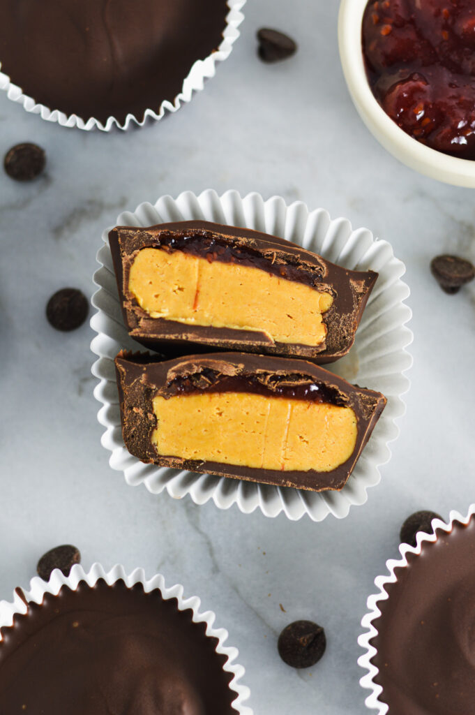 Overhead shot of Peanut Butter and Jelly Chocolate Cups in a white muffin cup.