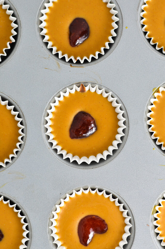 Peanut Butter and Jelly Nutella Cups in a mini muffin pan.