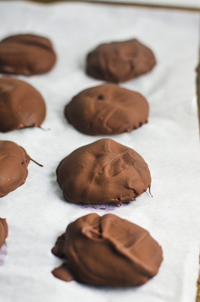 3 Ingredient Chocolate Yogurt Clusters on a parchment paper lined cookie sheet.