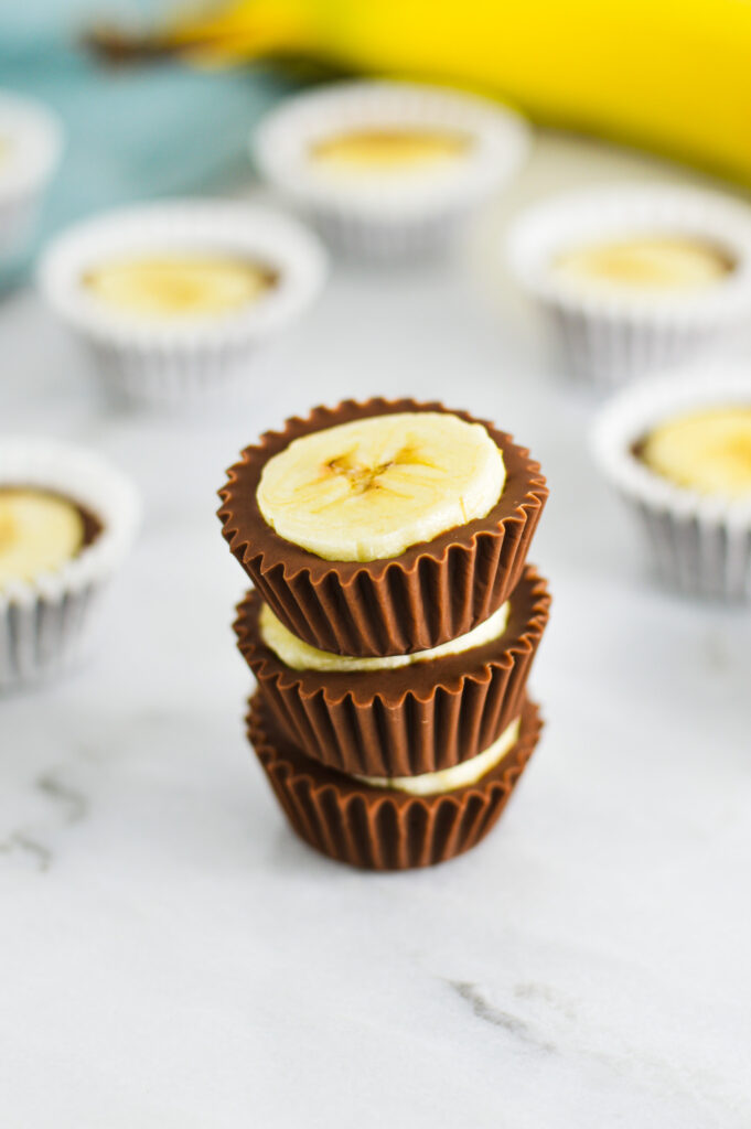 A stack of 3 Banana Nutella Cups with the mini paper liners taken off.