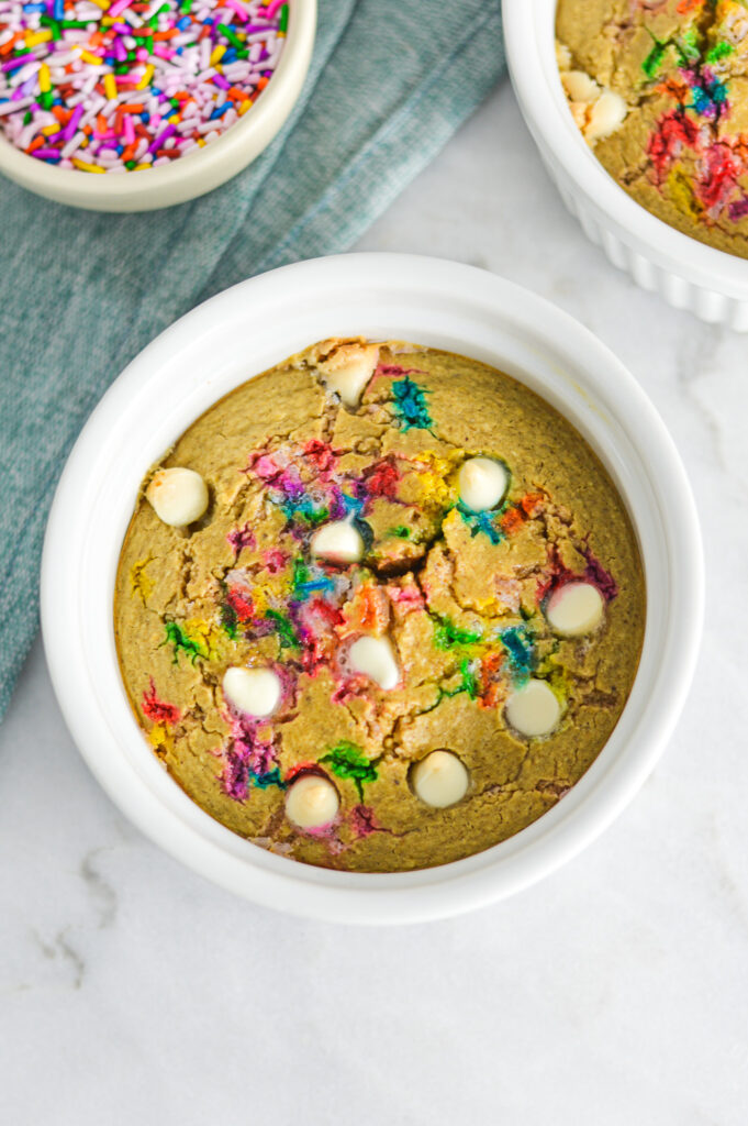 A small bowl full of golden brown Cake Batter Protein Blended Baked Oats.