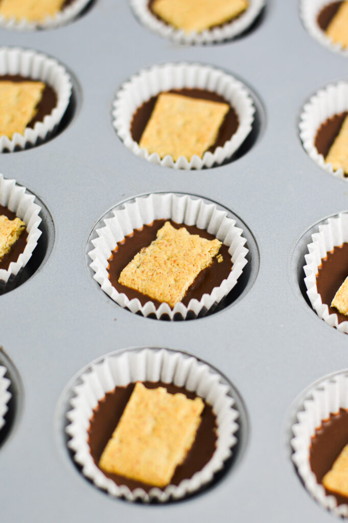 Graham Cracker Nutella Cups in a mini muffin pan with mini cupcake liners.