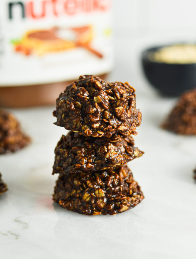 A stack of No Bake Nutella Oatmeal Cookies on a granite surface.