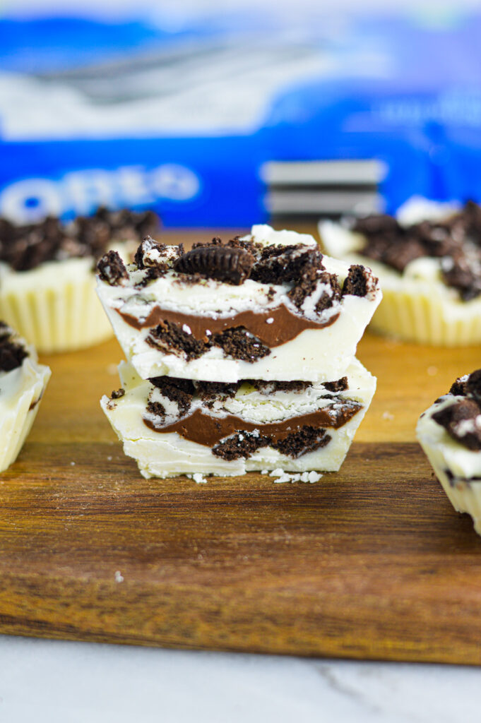 Nutella Stuffed Oreo Cups with a white chocolate coating and smooth Nutella inside.