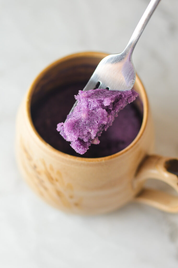 A fork showing the soft and fluffy texture of a Taro Mug Cake.