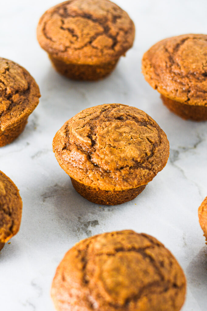 Soft Yogurt Nutella Muffins without paper liners on a granite surface.