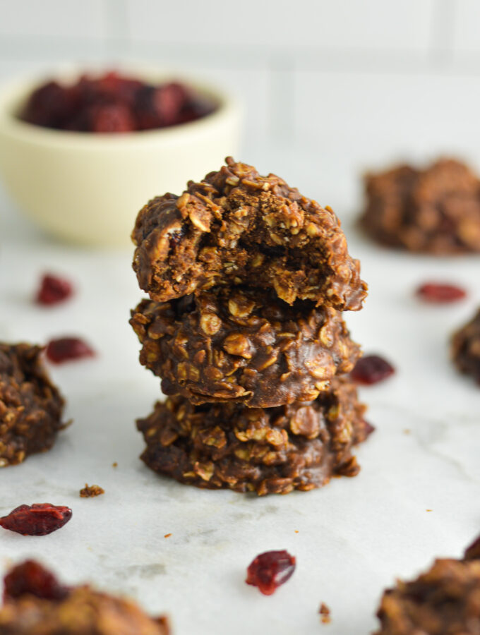 No Bake Nutella Cranberry Oatmeal Cookies arranged in a stack on a granite surface.