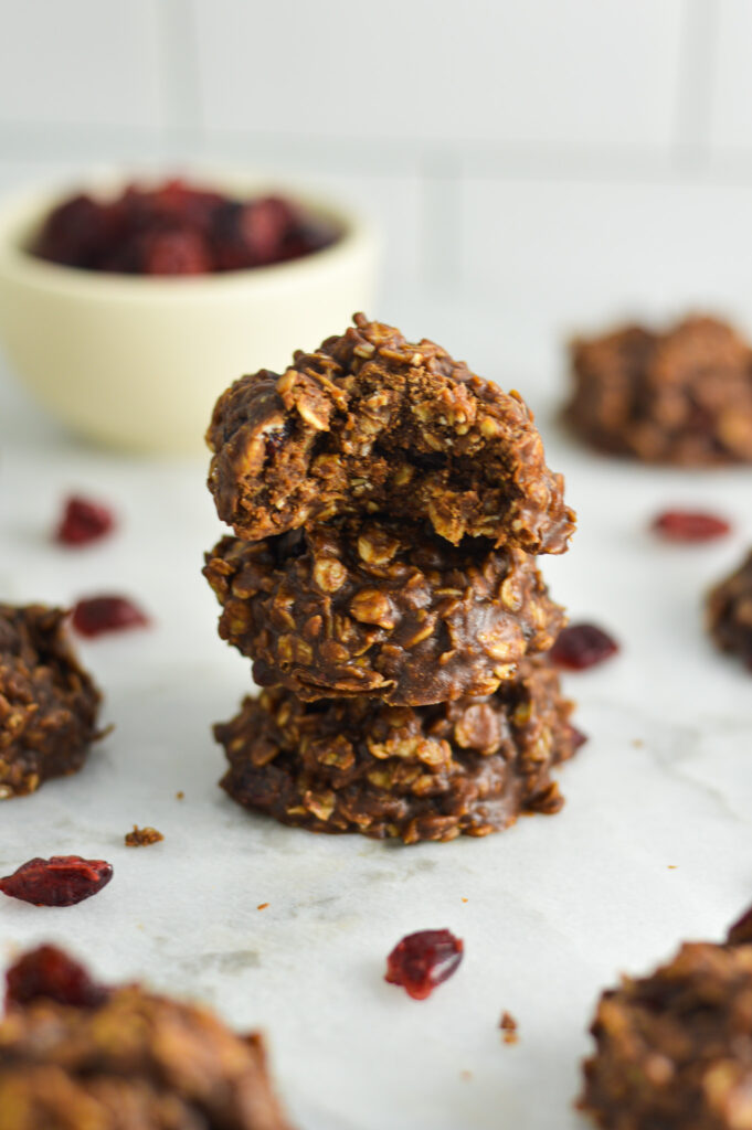 No Bake Nutella Cranberry Oatmeal Cookies arranged in a stack on a granite surface.