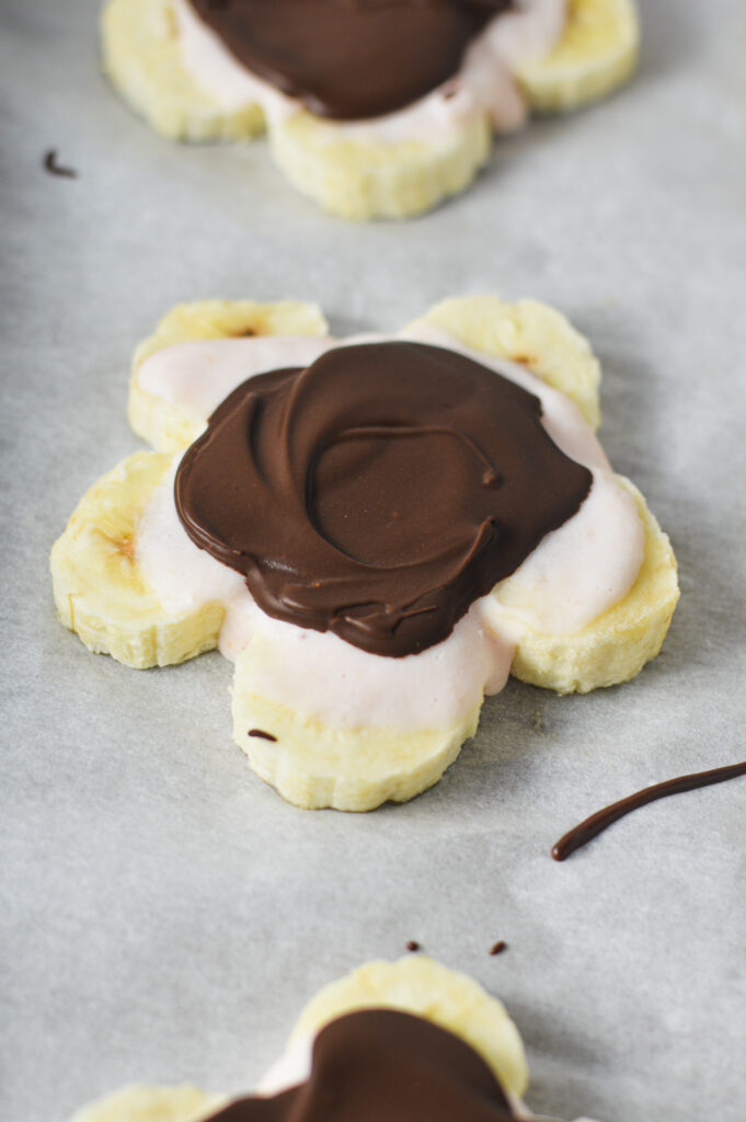 Mini Chocolate Banana Yogurt Bark on a parchment paper lined baking sheet.