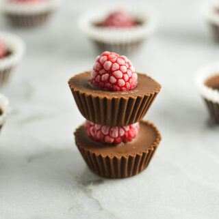 A stack of mini Raspberry Nutella Cups, with the red raspberries all frosty from being in the freezer.