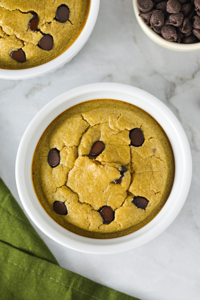 Soft Chocolate Chip Protein Blended Baked Oats, with semi-sweet chocolate chips atop the fluffy cake-like oatmeal.