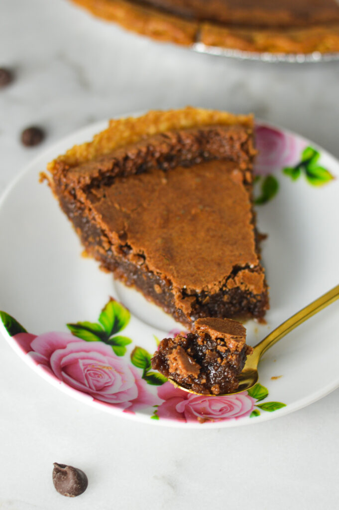 A spoon taking a fudgy scoop of Chocolate Chess Pie.