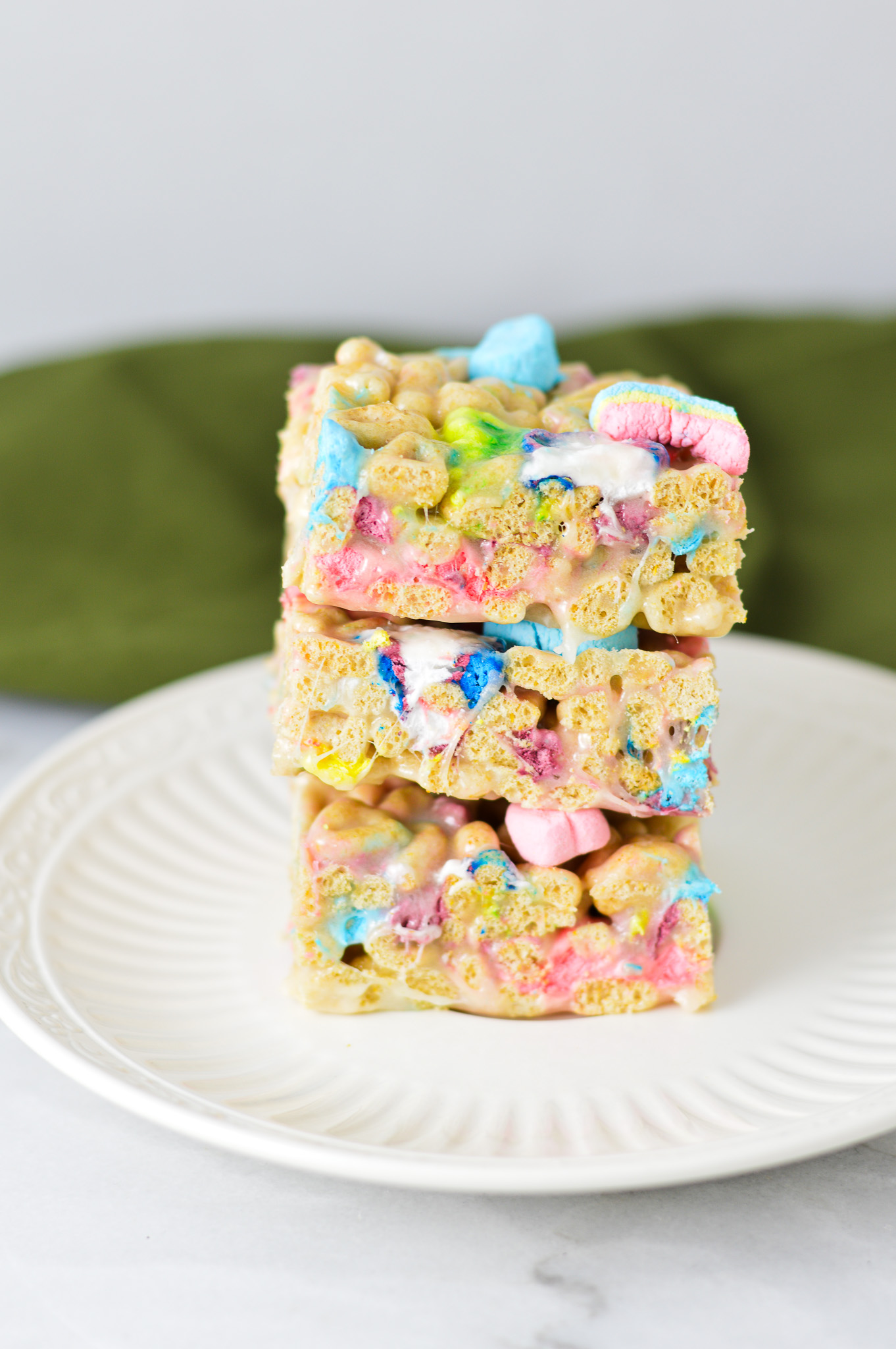 A stack of fun and nostalgic Lucky Charms Treats, packed with St Patrick's Day themed marshmallows.